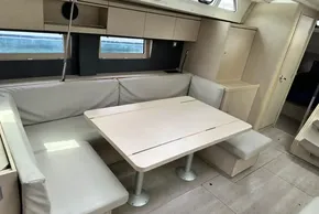 Modern interior of 2023 Beneteau Oceanis 51.1 yacht with sleek dining area.