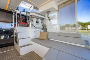 Luxurious interior of 2022 Leopard 50 yacht with seating and stairs.
