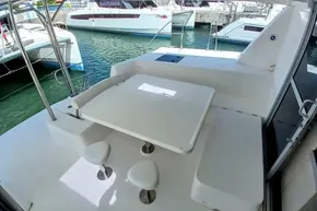 Outdoor seating area on a 2017 Leopard 48 yacht, docked at a marina.