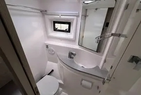 Modern bathroom in 2019 Leopard 51 Powercat yacht with sleek fixtures and window.