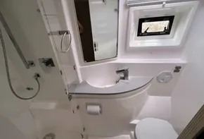Modern bathroom in 2019 Leopard 51 Powercat yacht with sleek fixtures and window.