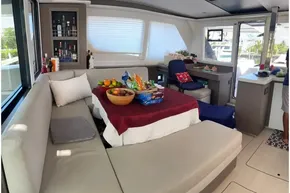 Luxurious interior of 2022 Leopard 45 yacht with cozy seating and refreshments.