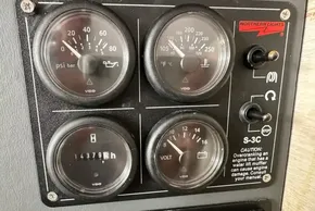 Control panel of a 2021 Leopard 50 with gauges and switches.