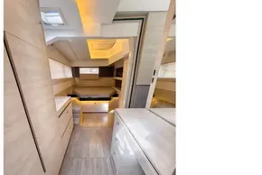 Luxurious interior of 2020 Leopard 50 yacht with modern wood finishes and ambient lighting.
