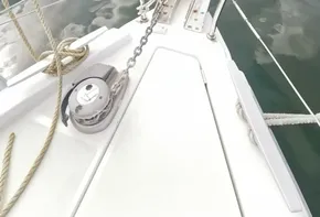 Beneteau Oceanis 46.1 sailboat bow, 2020 model, docked in a marina with other boats.
