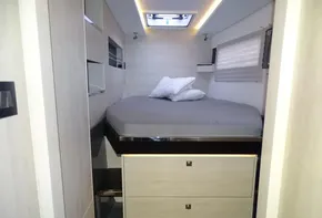 Cozy bedroom in 2017 Leopard 45 yacht with modern design and skylight.