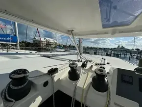 Leopard 50 catamaran deck view, showcasing winches and marina background, 2020 model.