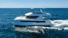 2025 Leopard 40 Powercat cruising on open sea under clear blue sky.