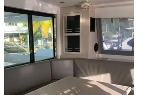 Interior of 2020 Leopard 40 catamaran with modern seating and large windows.