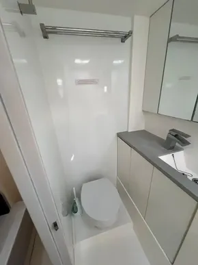 Modern bathroom in 2019 Leopard 45 yacht with sleek fixtures and ample storage.