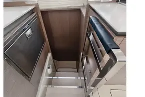 Interior of 2021 Leopard 50 yacht showing modern kitchen and staircase.