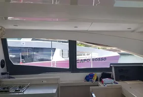 Interior of a 2017 Leopard 48 yacht with a view of another boat outside.