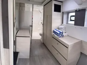 Modern interior of Leopard 50 yacht, 2020 model, featuring bathroom and storage area.