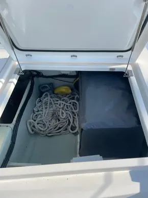 Storage compartment on a 2021 Leopard 45 yacht with coiled rope and equipment.