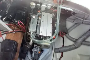 Engine compartment of a 2020 Lagoon 46 catamaran, featuring wiring and mechanical components.