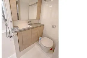 Modern bathroom in 2020 Leopard 50 yacht with sleek cabinetry and fixtures.