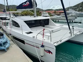 2020 Leopard 40 catamaran docked at marina with scenic background.