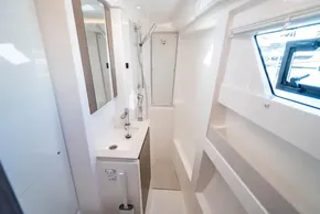 Modern bathroom interior of 2025 Leopard 46 yacht with sleek design and window view.