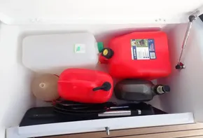 Storage compartment with fuel containers on a 2019 Jeanneau Sun Odyssey 440 sailboat.