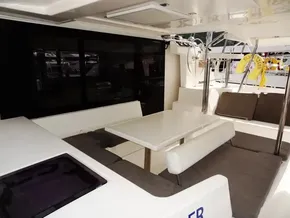 Interior of 2021 Leopard 40 catamaran with spacious seating and dining area.