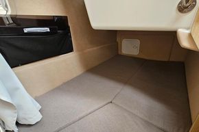 Interior cabin of 2023 Balt 818 Titanium boat, featuring cozy sleeping area.