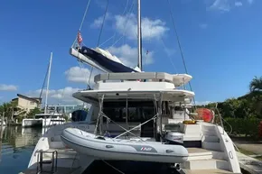 2022 Leopard 45 catamaran docked, featuring a spacious deck and inflatable dinghy.