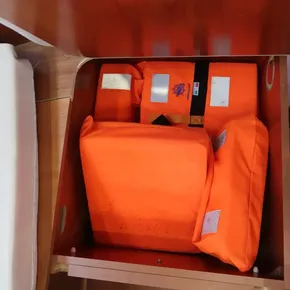 Orange life jackets stored in a Beneteau Oceanis 41.1 yacht, 2019 model.