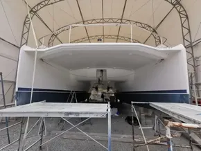 2015 Leopard 51 Powercat under maintenance in a covered dry dock.