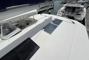 2019 Leopard 45 catamaran with solar panels docked at marina.