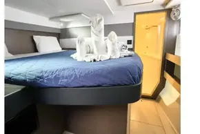 Luxurious cabin interior of 2021 Leopard 50 yacht with elegant bedding and towel art.