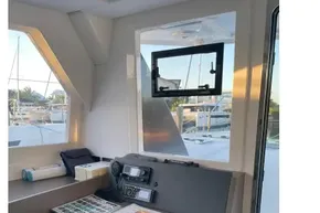 Interior of 2022 Leopard 42 yacht with navigation station and open window view.