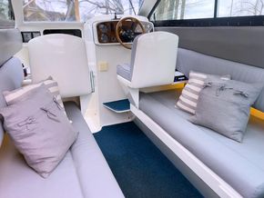 Interior showing helm, loo and galley