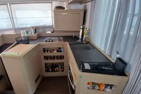 Modern kitchen in 2024 Lagoon 42 yacht with sleek design and ample storage.