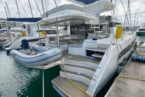 Luxury Leopard 50 catamaran yacht, 2019 model, docked with inflatable dinghy attached.