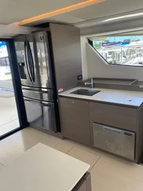 Modern kitchen on Leopard 53 Powercat 2021 with stainless steel appliances.