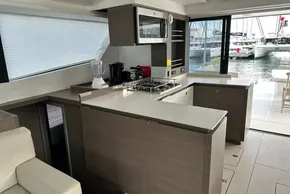 Modern kitchen interior on 2022 Leopard 53 Powercat yacht, featuring sleek design and appliances.