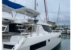 2022 Leopard 45 catamaran docked at marina, featuring sleek design and modern amenities.