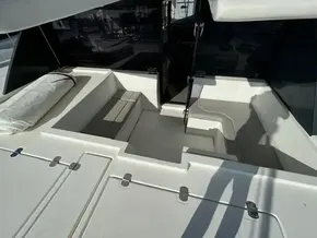 Leopard 50 yacht interior, 2020 model, featuring sleek white seating and modern design.