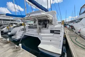 2020 Leopard 50 yacht docked at marina under clear blue sky.