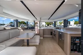 Luxurious interior of 2025 Leopard 46 yacht with modern kitchen and seating area.