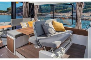 Jeanneau Merry Fisher 1095 Flybridge - co-pilot seat converts to seating at table