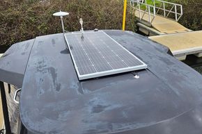 Rooftop solar panel on 2023 Balt 818 Titanium boat near dock.