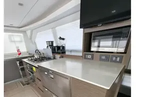 Modern kitchen interior on a 2021 Leopard 50 yacht, featuring sleek appliances and ample counter space.