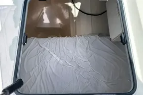 Interior cabin view of 2022 Leopard 53 Powercat with white bedding.