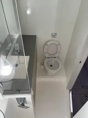 Modern bathroom in a 2020 Leopard 50 yacht with toilet and sink.