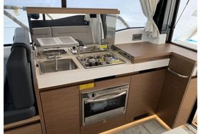 Jeanneau NC 37 twin diesel cruiser - galley with stove, oven and sink