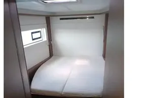 2020 Lagoon 46 yacht cabin interior with bed and window.