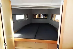 2017 Beneteau Oceanis 38 interior cabin with double bed and windows.