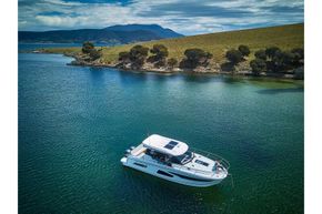 Jeanneau Merry Fisher 1095 - overhead view on the water from starboard side
