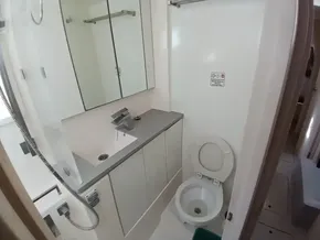 Modern bathroom in 2019 Leopard 45 yacht with toilet and sink.